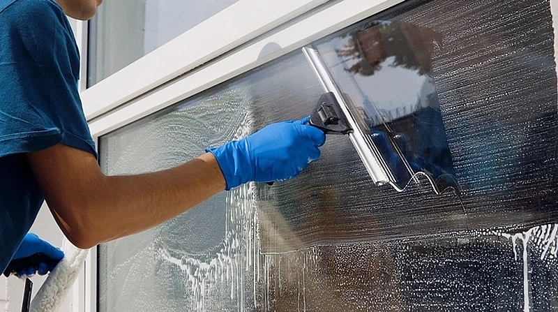 Cleaning windows inside a building